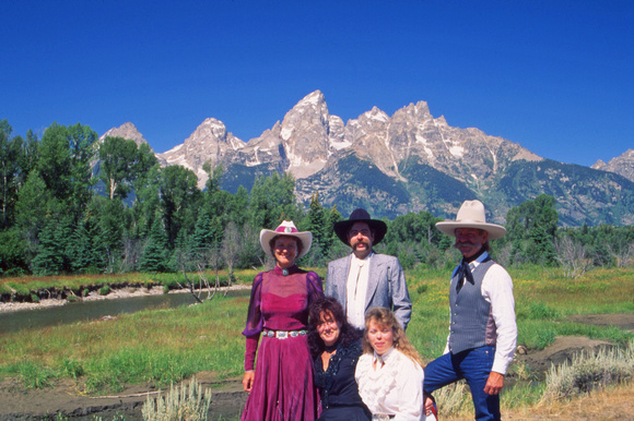 Cowboy family and Tetons
